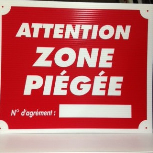 Pancarte attention zone piégée