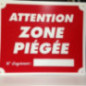 Pancarte attention zone piégée